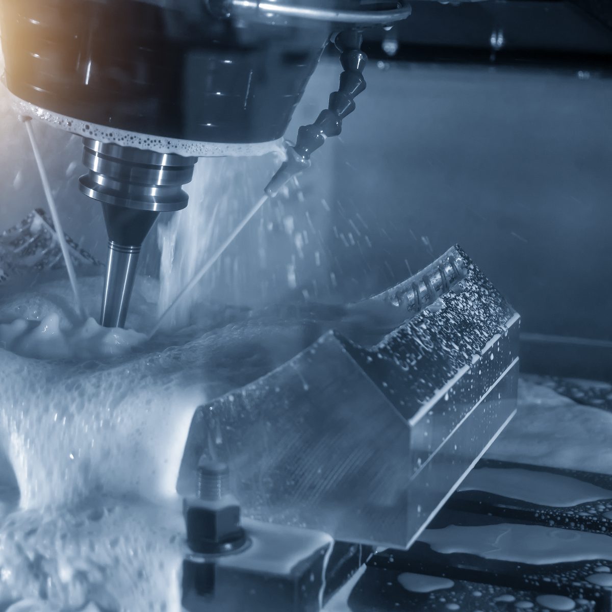 The 5-axis CNC milling machine or machining center cutting the tire mold part with the solid ball endmill tool in the light blue scene.The Hi-Technology manufacturing process.